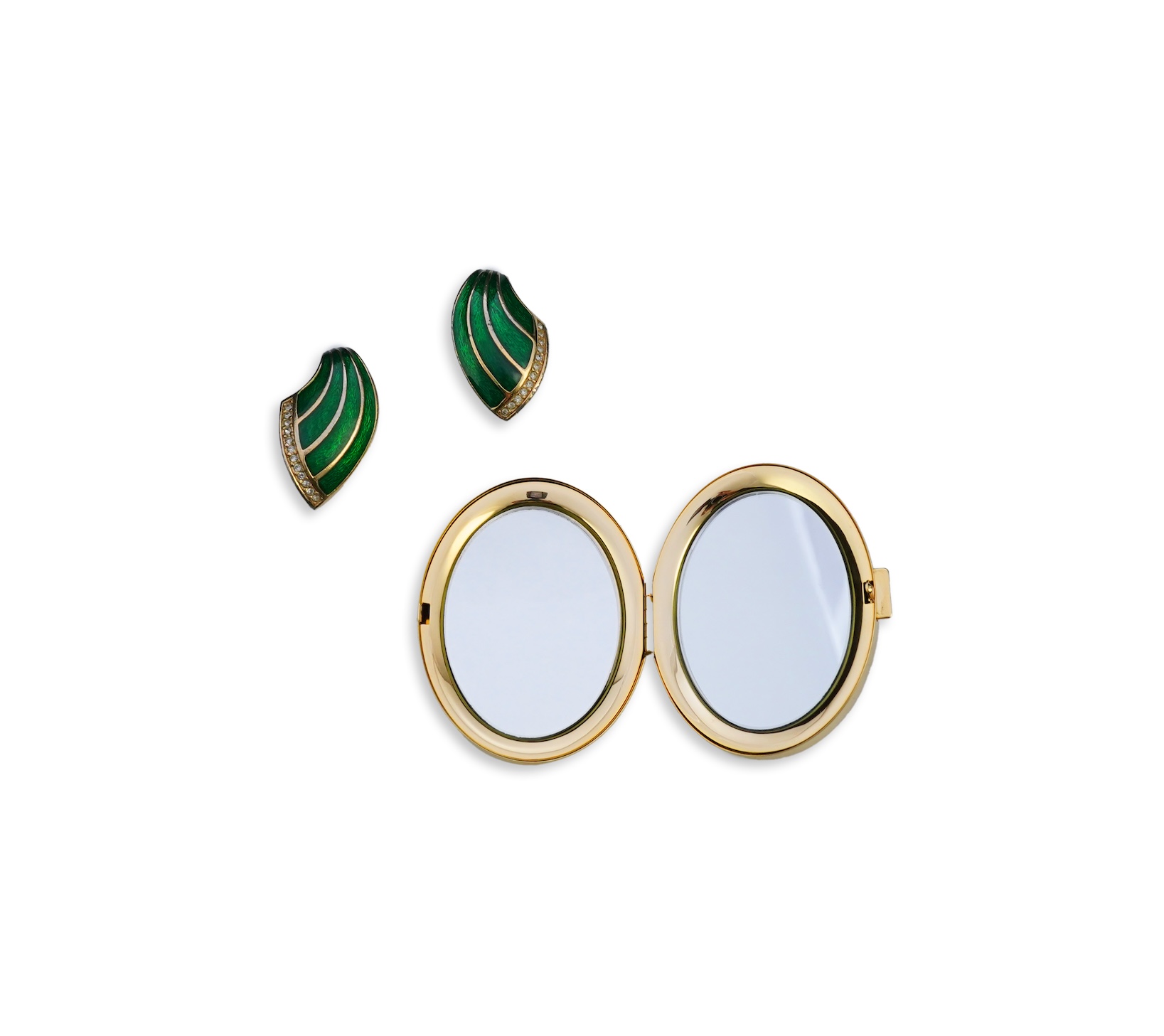 A pair of Christian Dior vintage earrings and compact mirror.